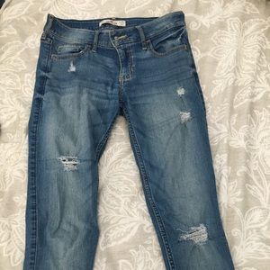 medium wash distressed hollister skinny jeans